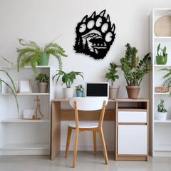 This modern metal art for walls features a fierce bear paw design above a home office desk, blending wild themes with indoor tranquility.