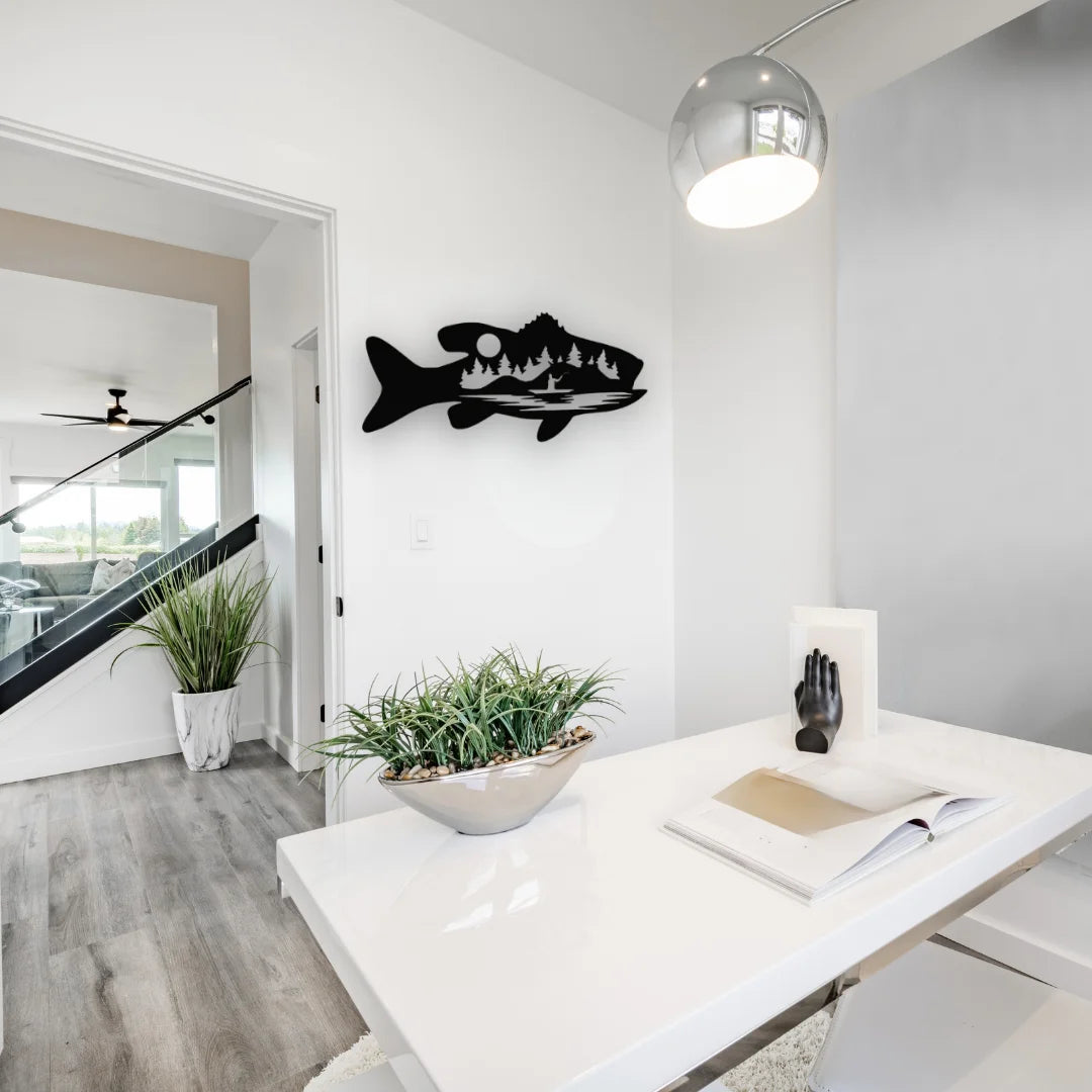 This modern workspace gains personality through a dramatic wall art fishing scene, featuring trees and water inside a fish silhouette.