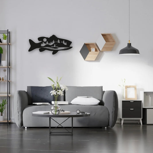 A bold metal fish wall art piece featuring trees and a wilderness silhouette adds character to this monochrome modern living room.