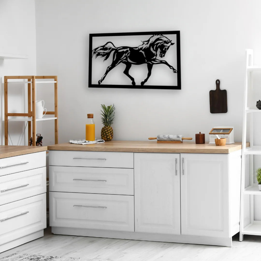 Black metal horse signs add dynamic energy above a white countertop, blending rustic motion with clean, modern lines.