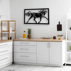 Black metal horse signs add dynamic energy above a white countertop, blending rustic motion with clean, modern lines.