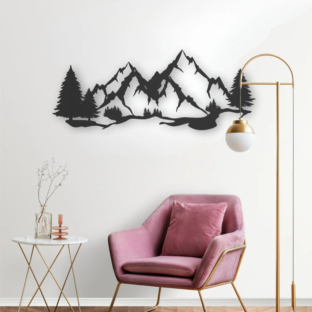 A sleek metal wall accents piece showing a mountain silhouette contrasts beautifully with this soft, feminine corner setup for relaxation.