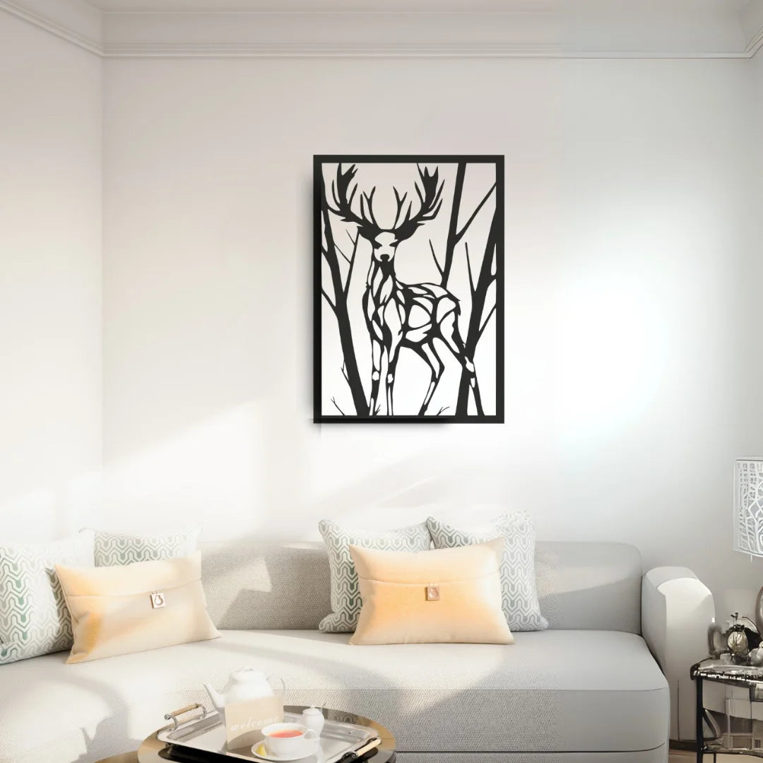A striking black metal wall art decor for living room featuring a majestic deer with antlers, displayed above a cream-colored couch with soft throw pillows.
