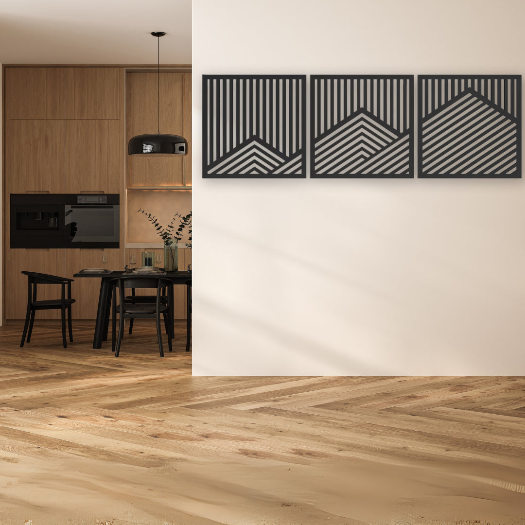 Three-panel geometric metal wall art in black and silver tones enhances a contemporary kitchen-dining space with its clean lines and modern metal wall art appeal.