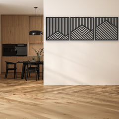 Three-panel geometric metal wall art in black and silver tones enhances a contemporary kitchen-dining space with its clean lines and modern metal wall art appeal.