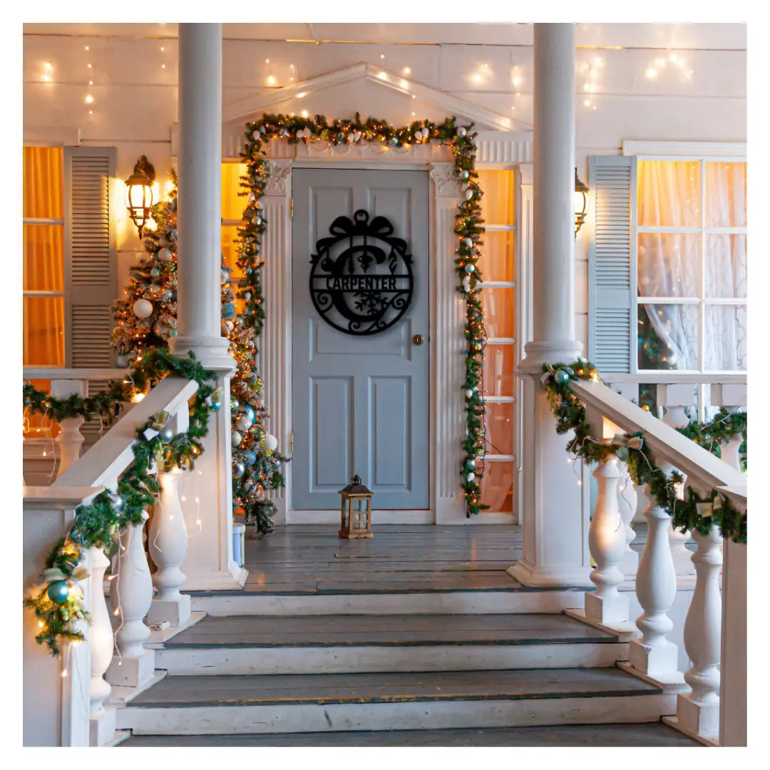 A circular custom metal signs design shaped like a gift with snowflake cutouts and family name text hangs on a decorated door, a standout customized metal signs piece for holidays.