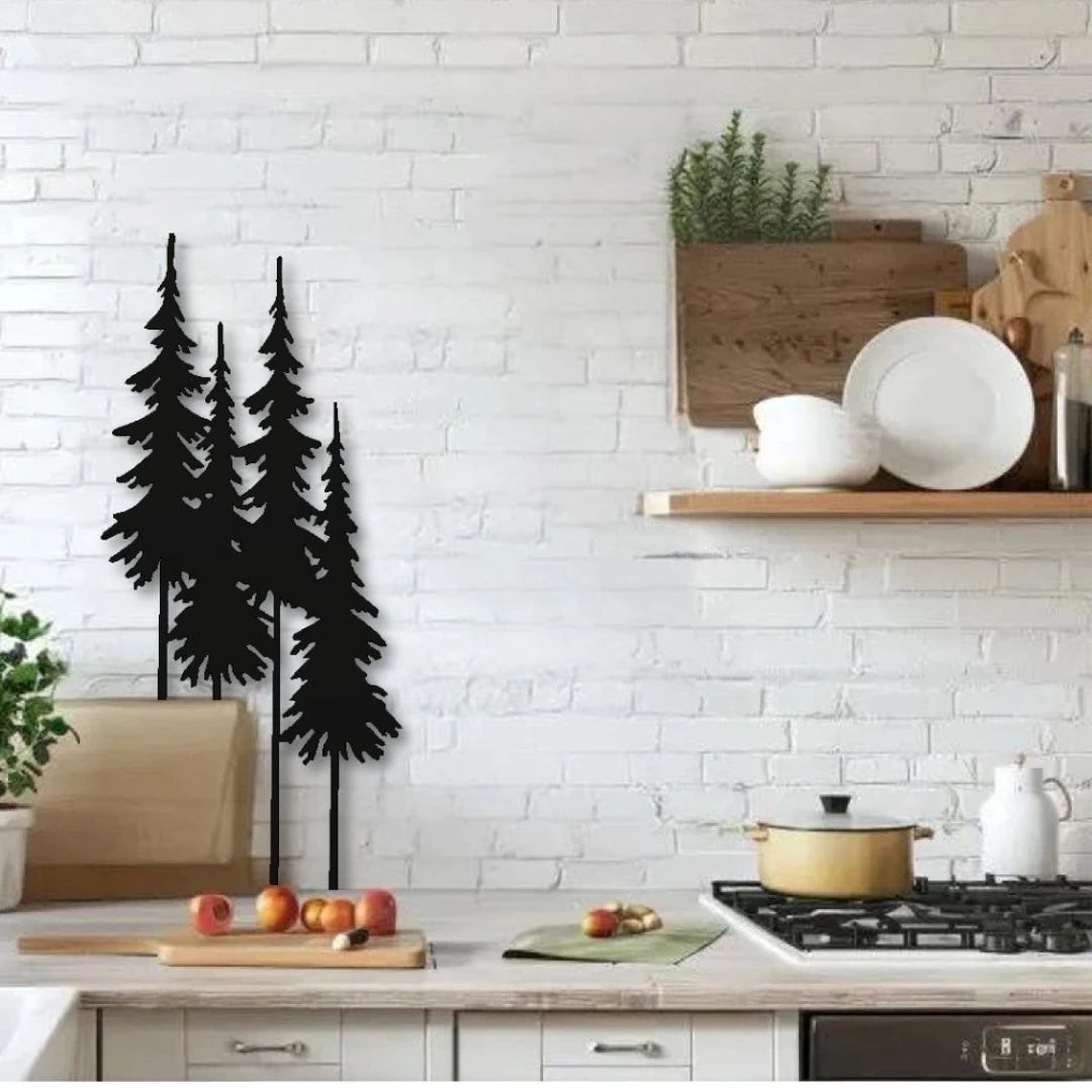Three vertical pine tree silhouettes form a unique metal kitchen wall art piece on a white brick wall, balancing rustic charm with clean decorative metal art for walls.