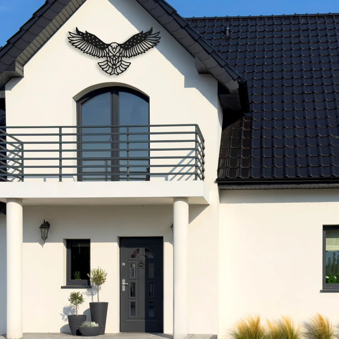 A bold black metal eagle sculpture soars above the front balcony, making a commanding impression and enhancing curb appeal.