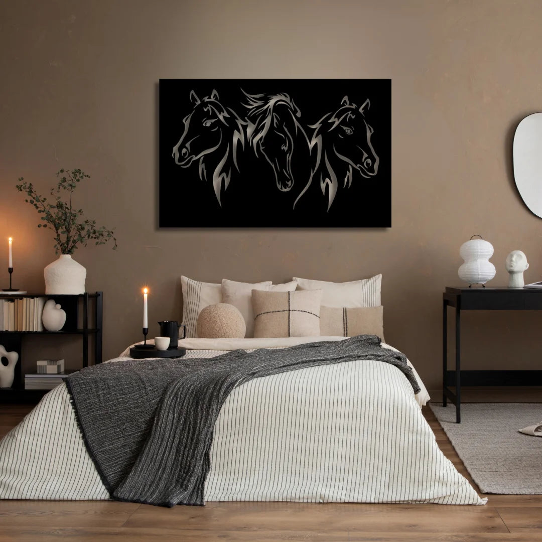 A powerful black piece of metal home decoration with three horses gives a bold and rustic touch to this serene master bedroom.