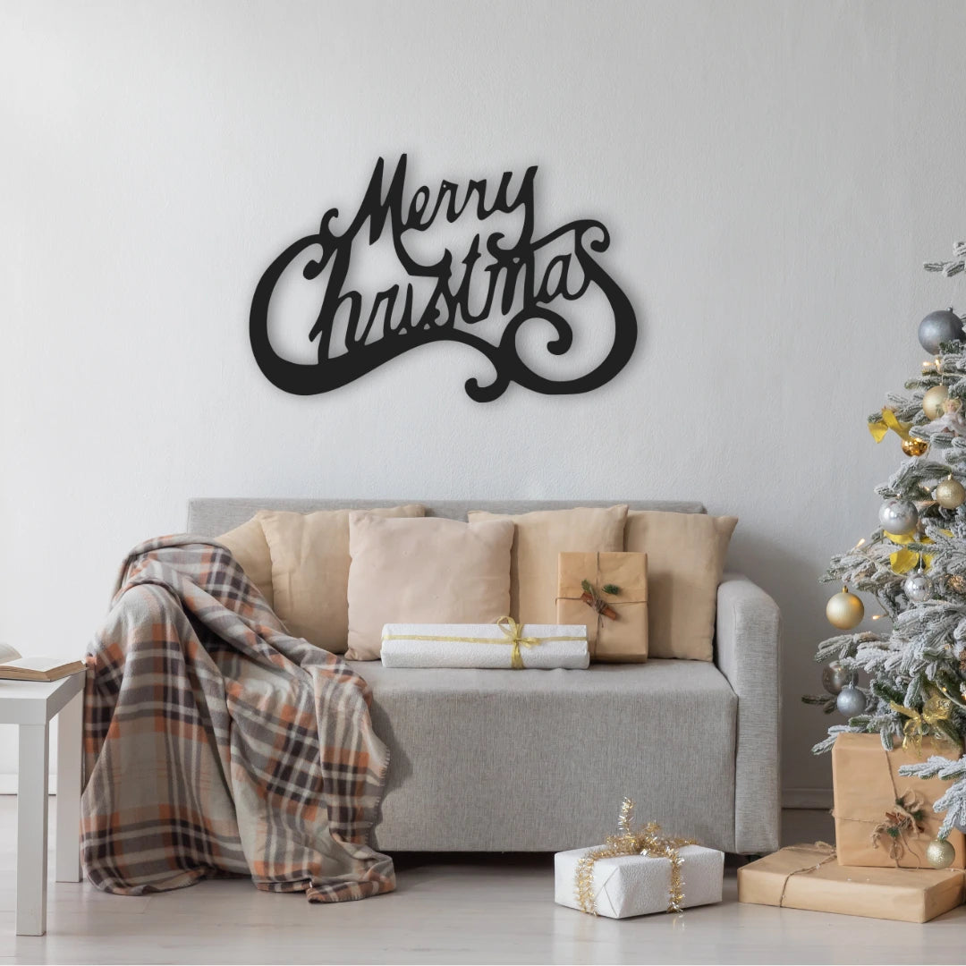 A flowing black metal wall decor reading “Merry Christmas” adds cheer above a cozy gift-wrapped couch, blending holiday comfort with artistic word wall art style.