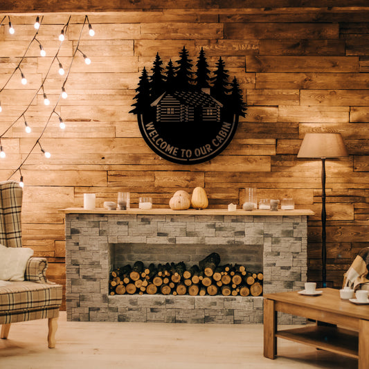 A cozy welcome sign cut from black steel with a cabin and forest scene invites warmth into a rustic living space—perfect for fans of metal sign welcome decor.