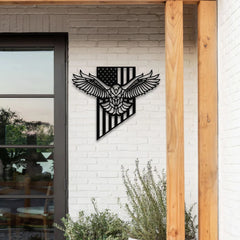 A detailed bald eagle flag metal artwork featuring the American flag and eagle silhouette, mounted on a white brick wall beside a patio entrance.
