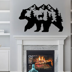A bold black metal wall art of a bear with forest and deer silhouette detail mounted above a fireplace, creating a striking focal point in a modern rustic living room.
