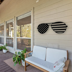 An eye-catching american flag rectangle design in the shape of sunglasses creates a bold patriotic statement on this porch wall.

