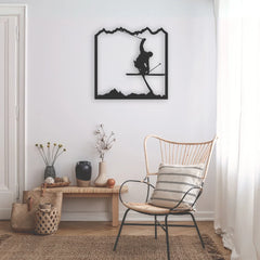 A minimalist metal wall decor black of a skier catching air in the mountains, perfect for alpine enthusiasts seeking bold, dynamic wall art.
