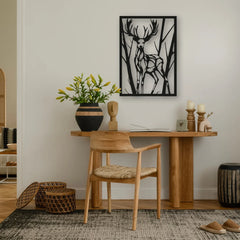 A stylish metal wall deco of a deer silhouette brings forest calm to this natural-tone workspace.
