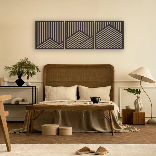 A minimalist geometric panel made from black metal adds structure and depth above the bed, creating an elegant accent in this earth-toned bedroom.
