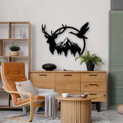This black metal artwork features a deer, flying goose, and pine trees with mountains in the backdrop—bringing the outdoors inside with a silhouette-style metal design.
