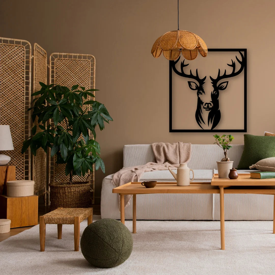 A textured metal wall hanging decor featuring a deer silhouette makes a striking statement against earthy walls and soft-toned furniture.
