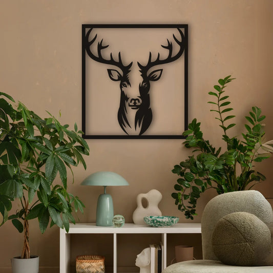 A bold metal wall decor black featuring a detailed stag’s head in profile, ideal for creating a rustic focal point in your living space.
