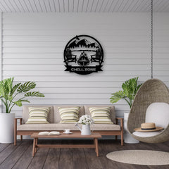 A round custom man cave sign reading “Chill Zone” with mountains and camp chairs, setting a cozy vibe in this breezy outdoor lounge.
