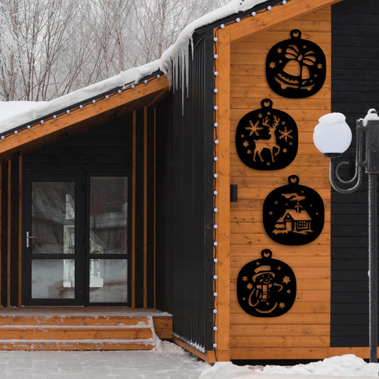 A quartet of large outdoor wall decorations metal shaped like ornaments—snowman, reindeer, sleigh, and tree—brightens up a cabin-style facade.
